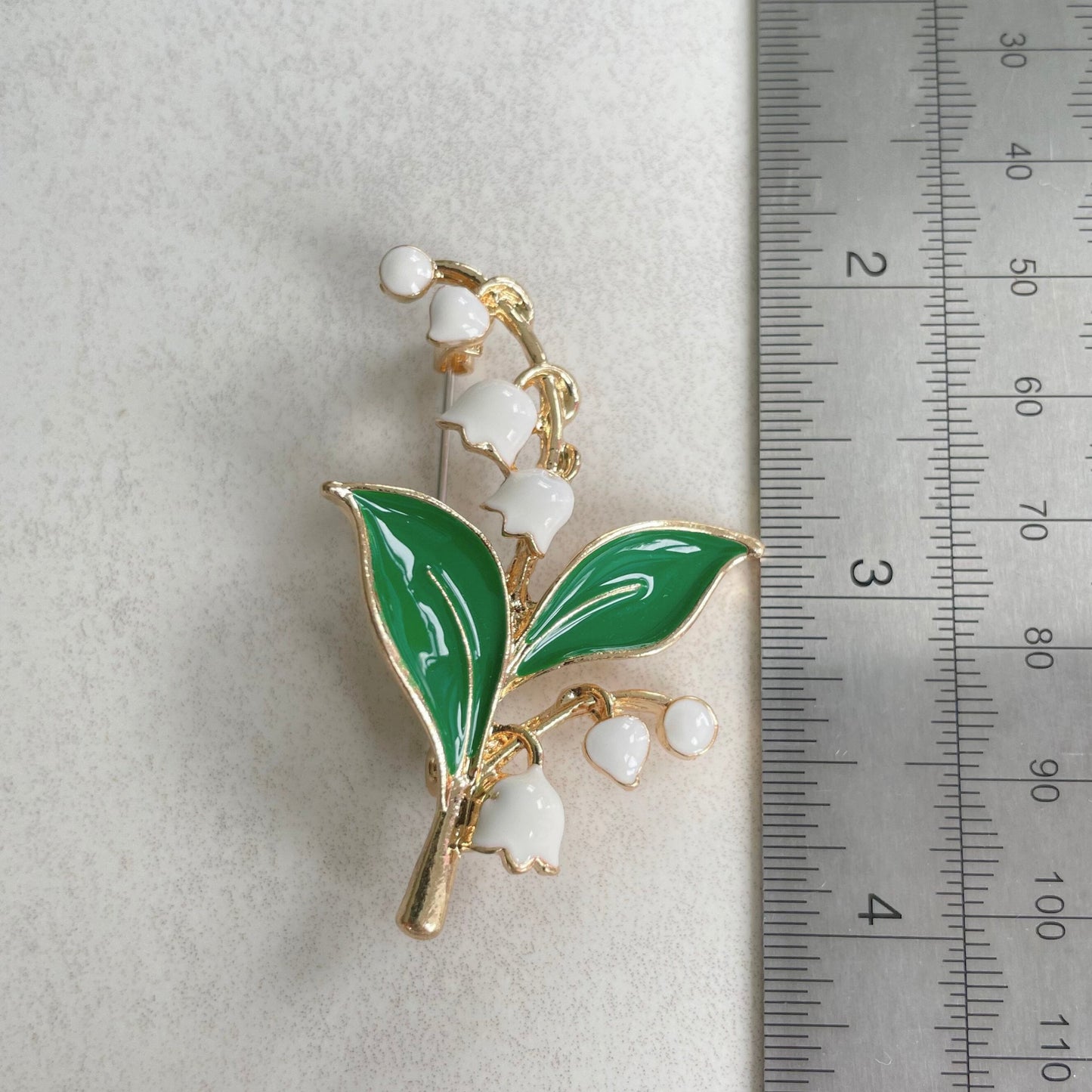 Delicate Lily of the valley flower gold pin brooch