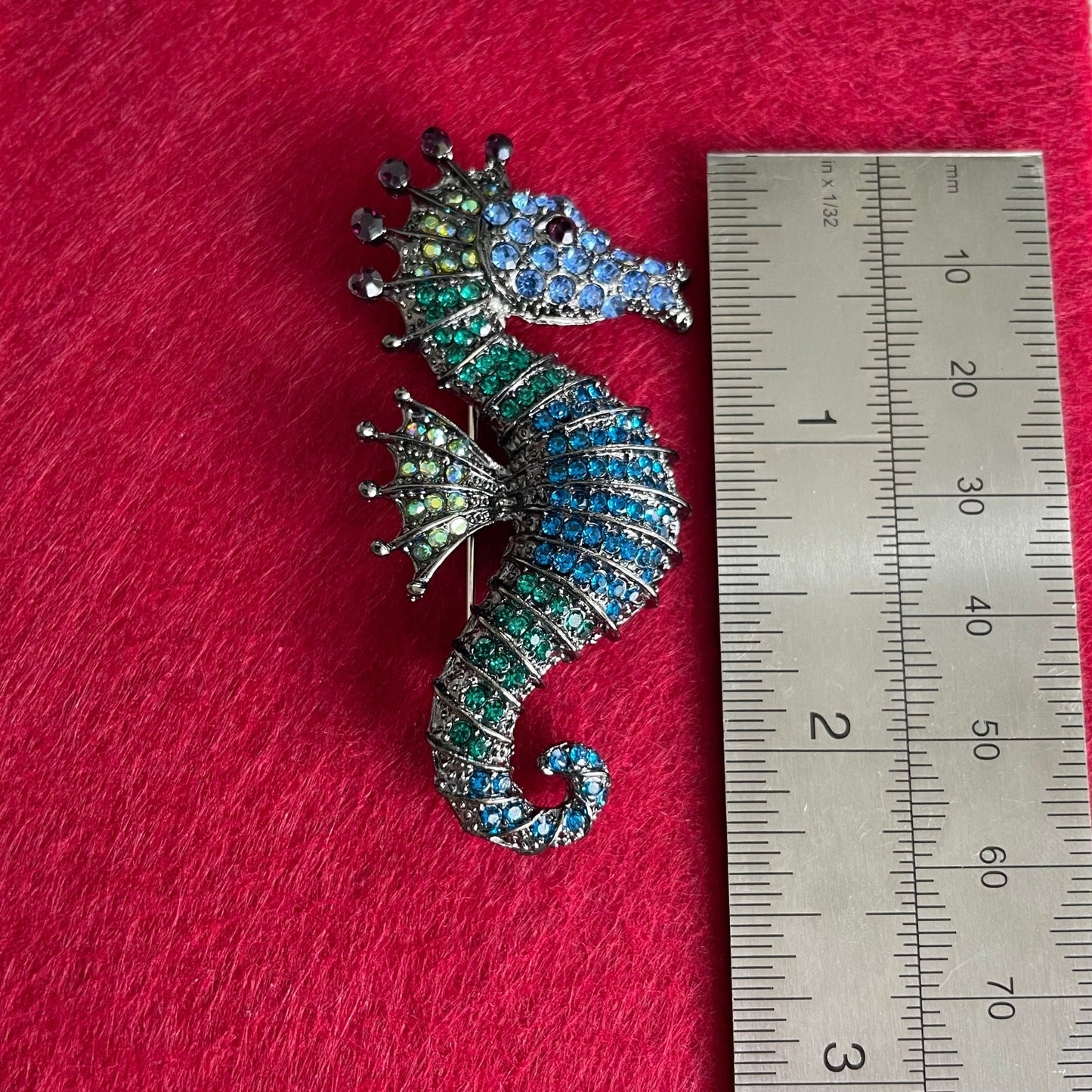 Green and blue seahorse pin brooch