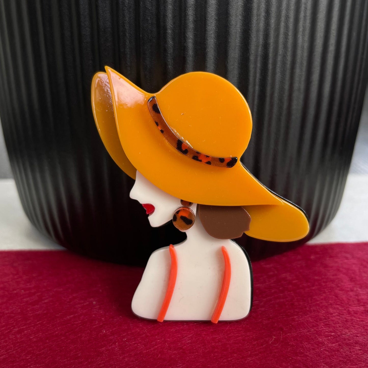 Art Deco lady with orange hat acrylic pin brooch