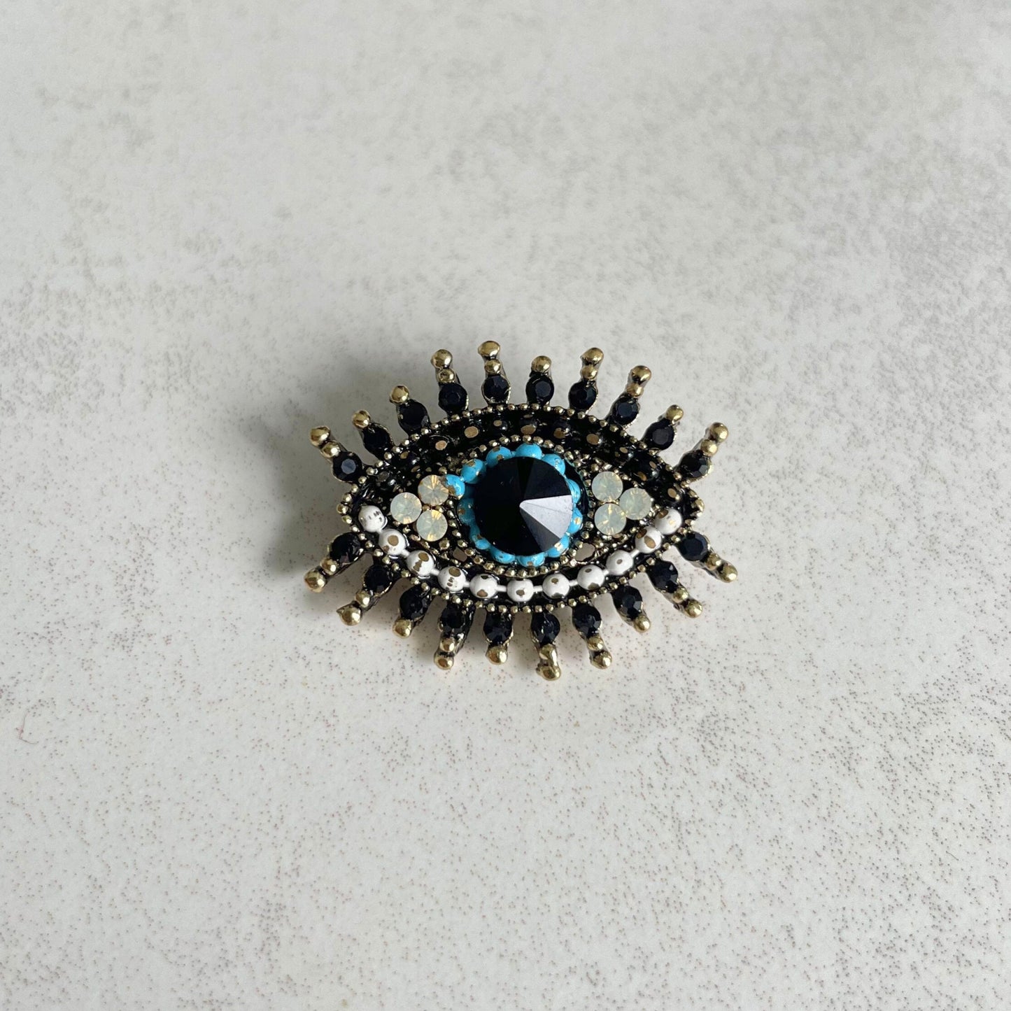 Small blue evil eye gold pin brooch