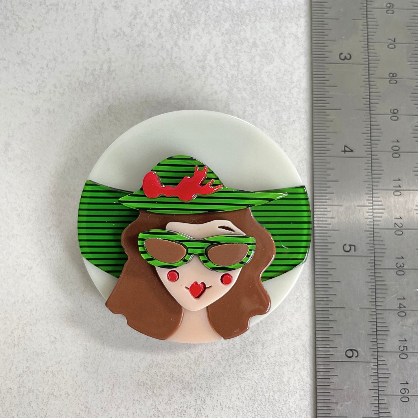 Art Deco lady with green hat acrylic pin brooch