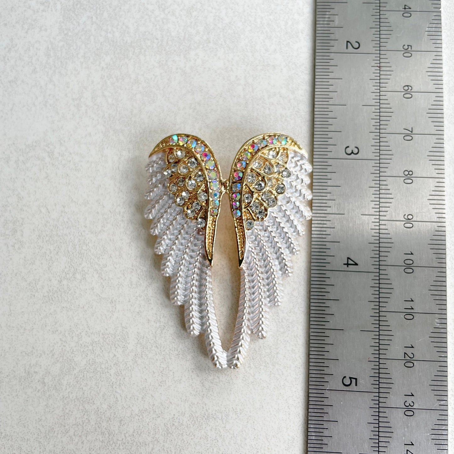 Delicate white enamel angel wings gold pin brooch