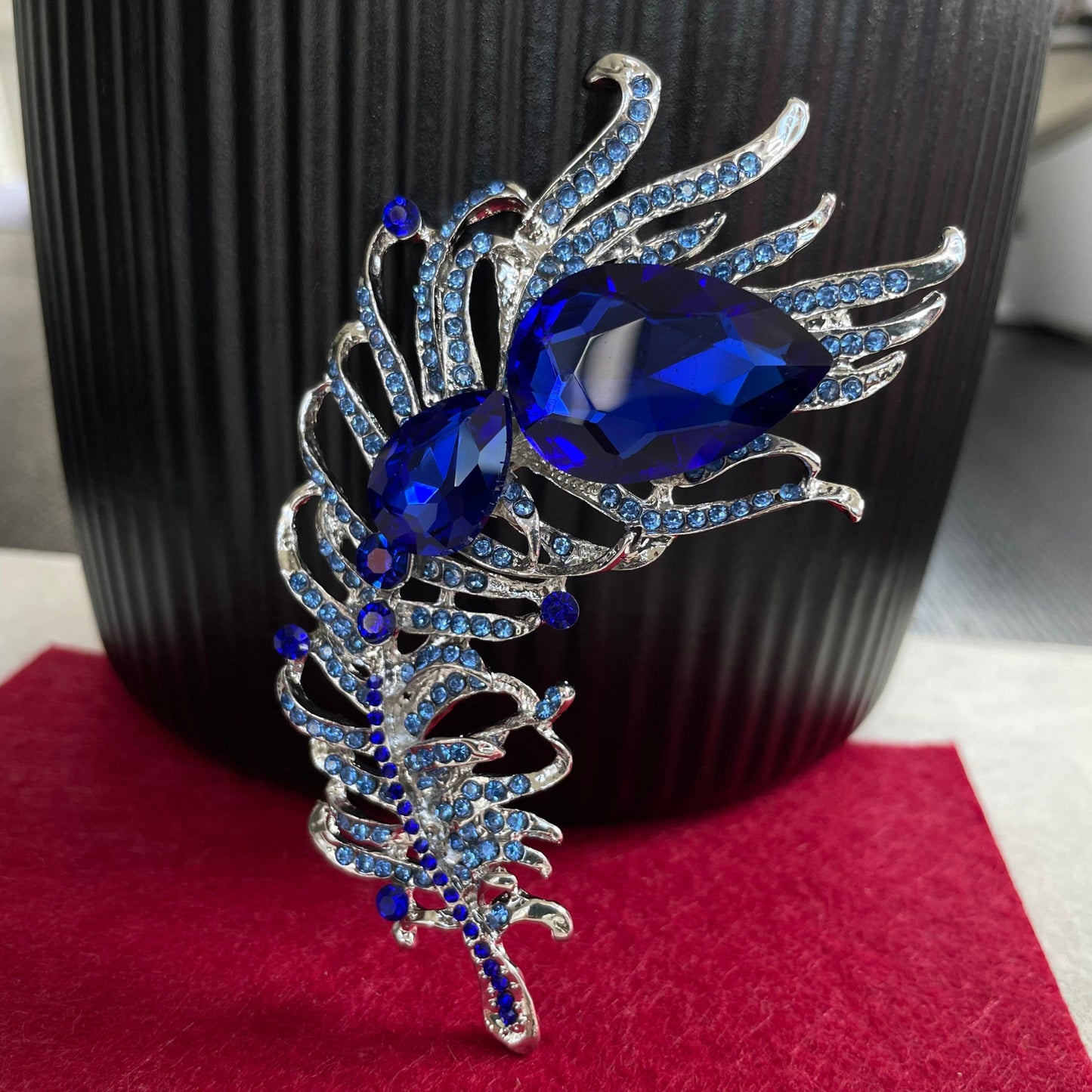 Statement sapphire feather silver pin brooch