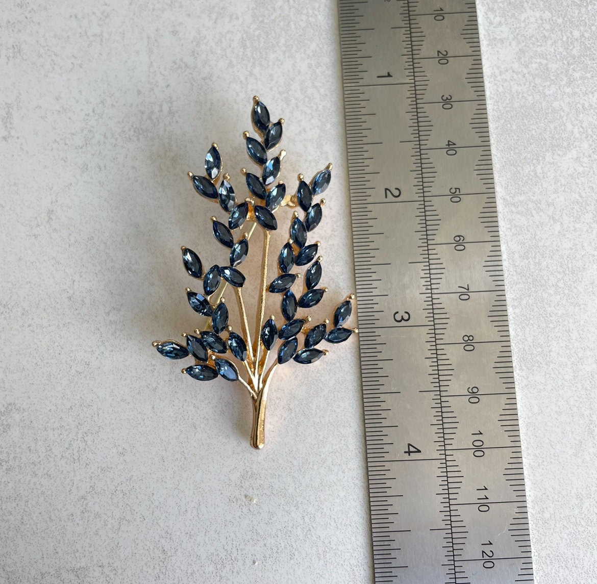 Blue sapphire tree branch gold and silver brooch