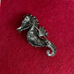 Green and blue seahorse pin brooch