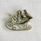 Charming Santa sleigh presents gold pin brooch