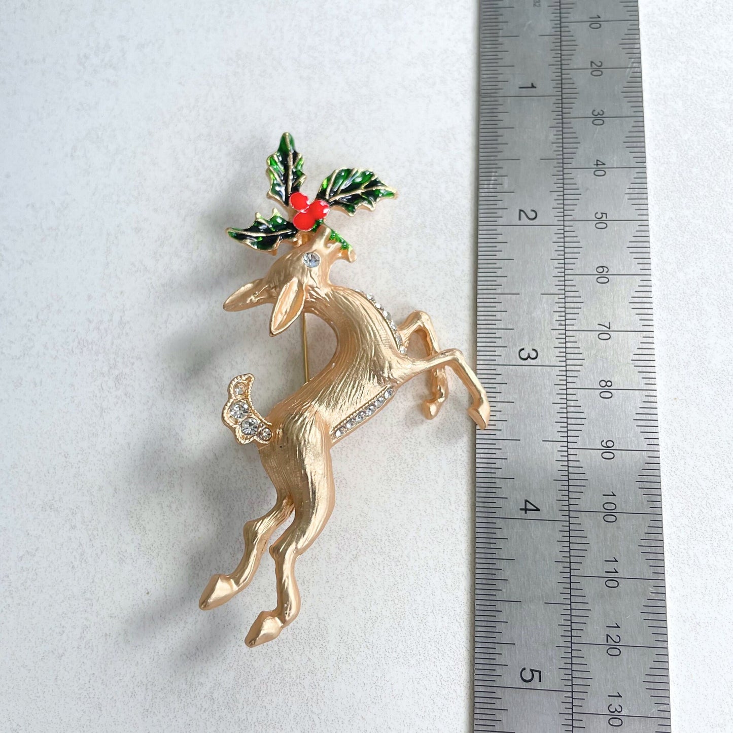 Charming reindeer Holly flower gold pin brooch