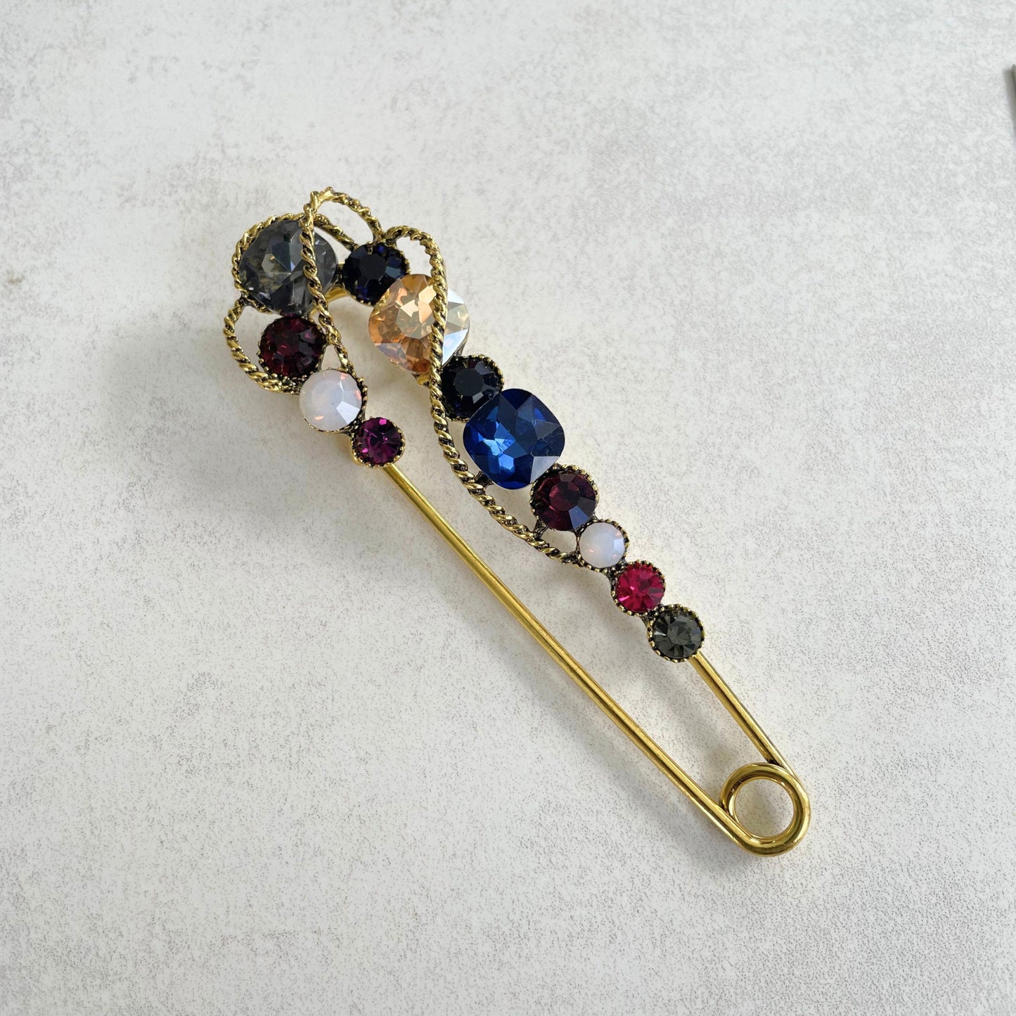 Vintage style blue sapphire safety pin gold brooch