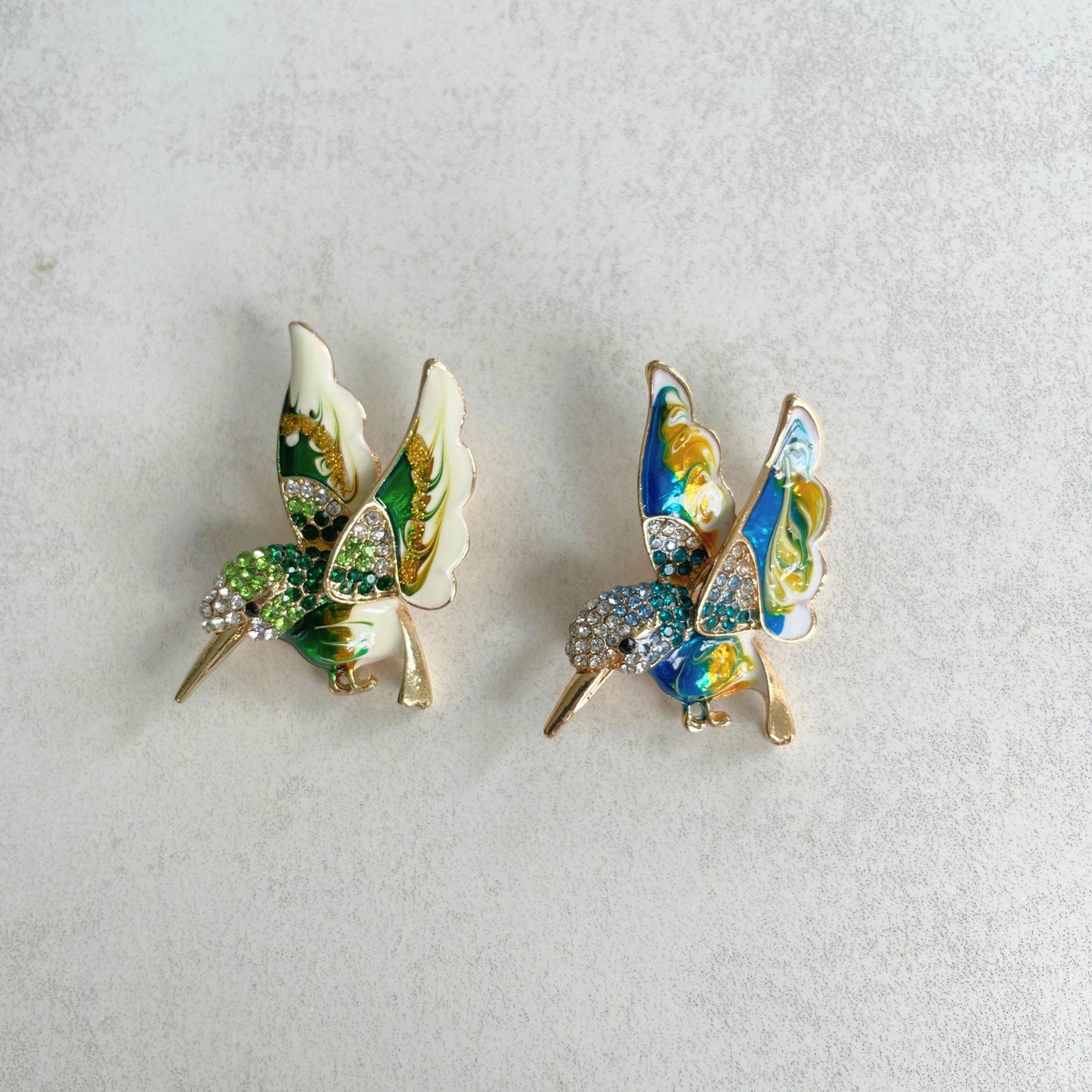 Delicate green hummingbird gold pin brooch