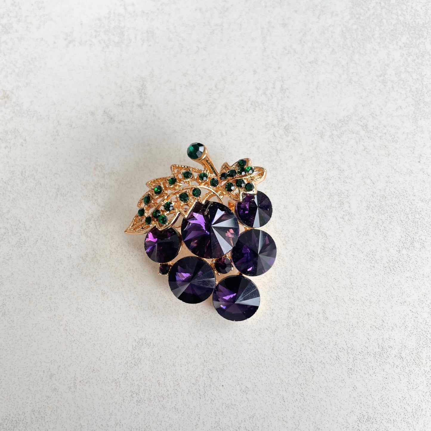 Purple rhinestone grapes green leaf gold pin brooch