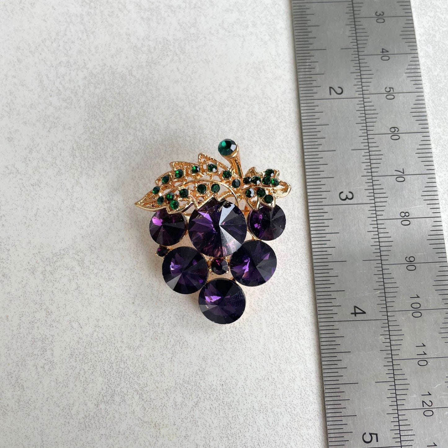 Purple rhinestone grapes green leaf gold pin brooch