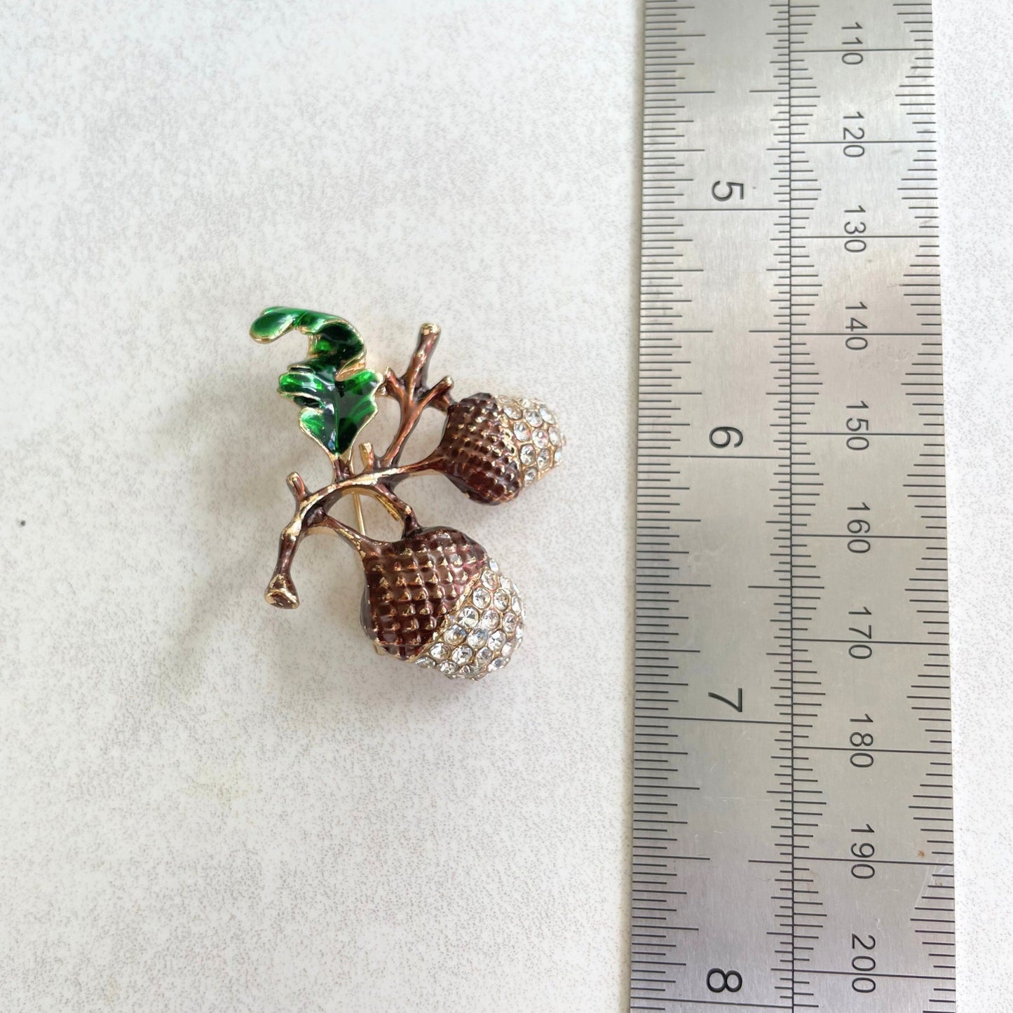 Dainty brown enamel acorn brooch