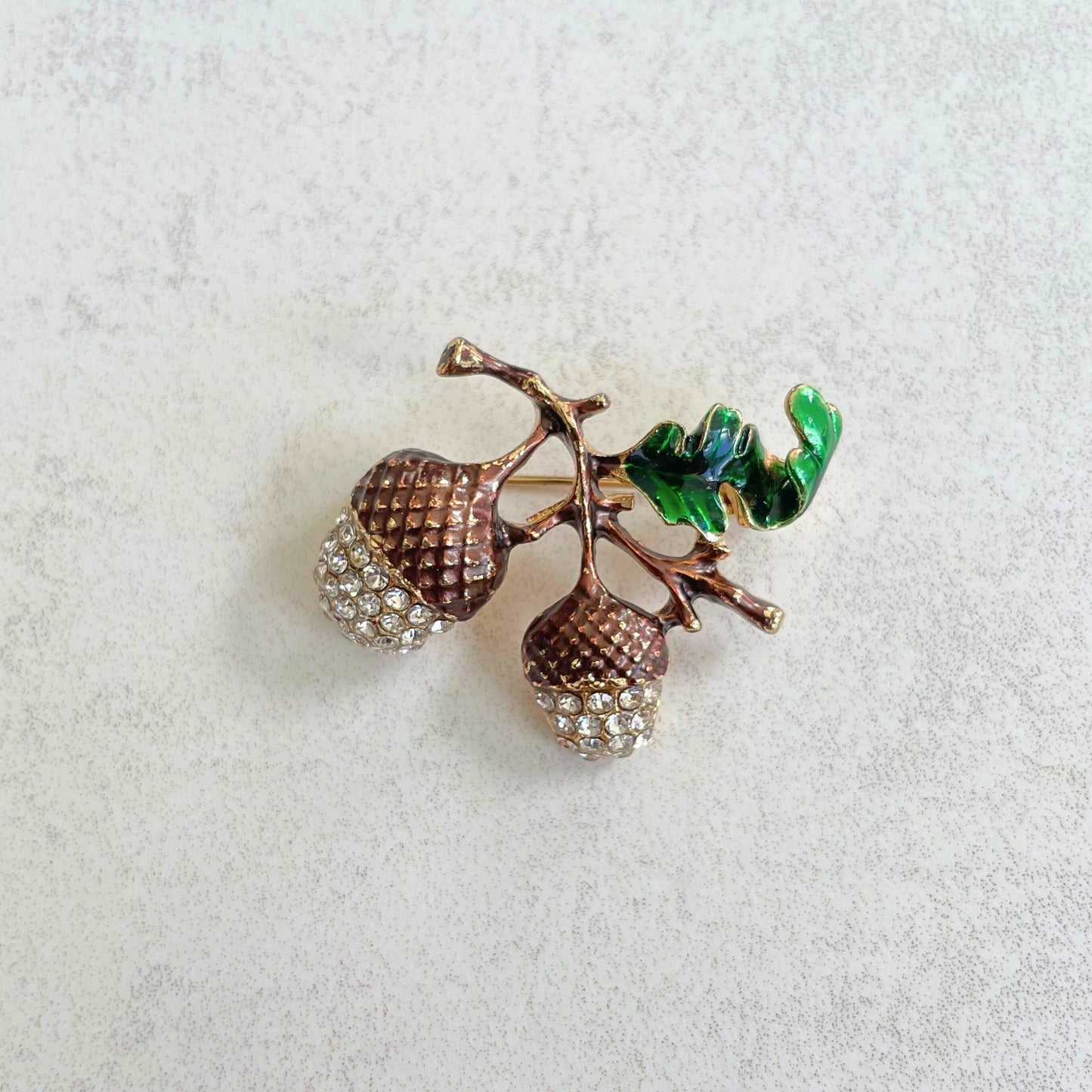 Dainty brown enamel acorn brooch