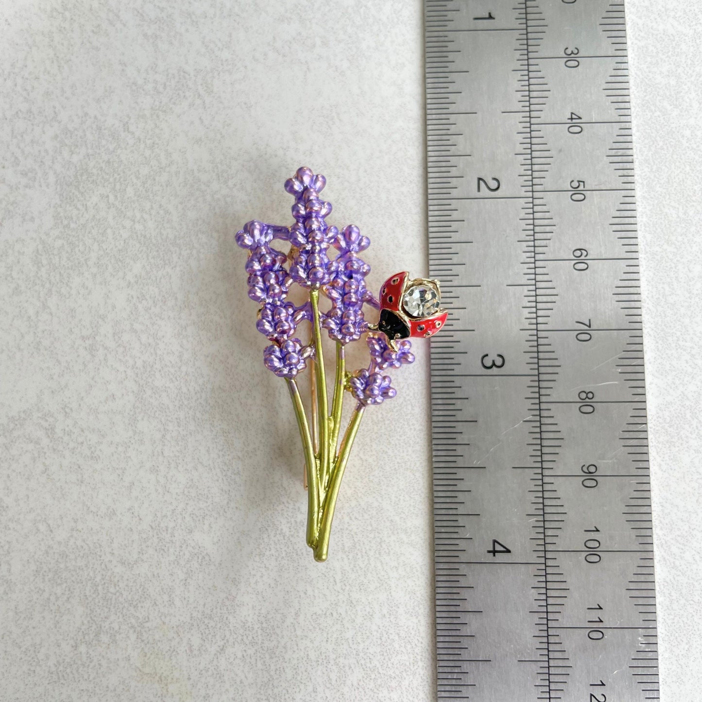 Delicate purple lavender flower ladybug gold pin brooch