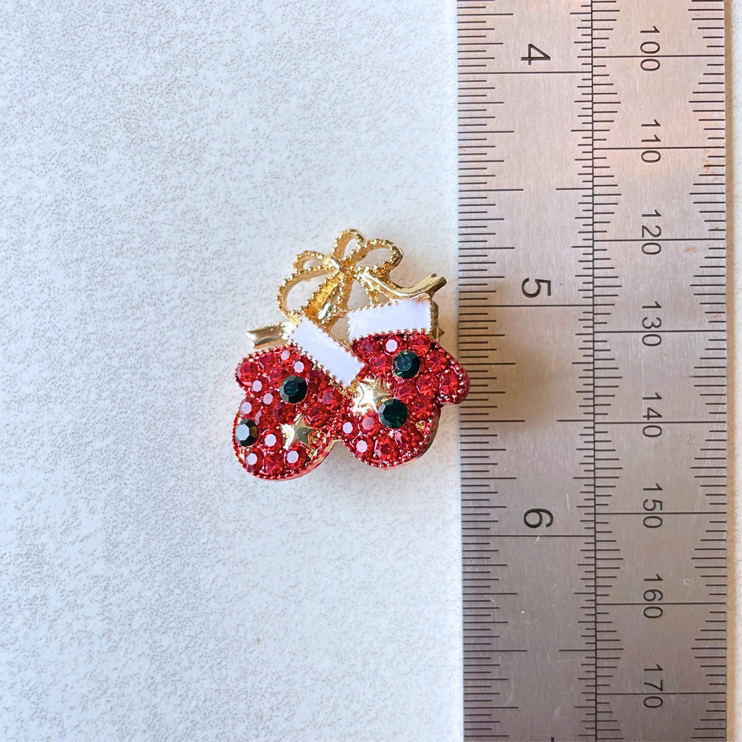 Charming Christmas gloves gold pin brooch