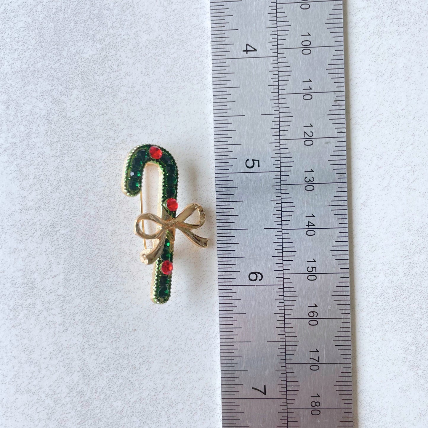 Charming green candy cane ribbon gold pin brooch